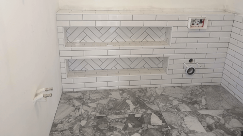 Shane Daly Tiling - Herringbone Pattern and Subway Tile - Bathroom tile with Patterned Nooks
