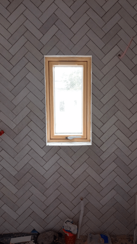 Shane Daly Tiling - Herringbone Tile - Whole Bathroom - Window Cut out